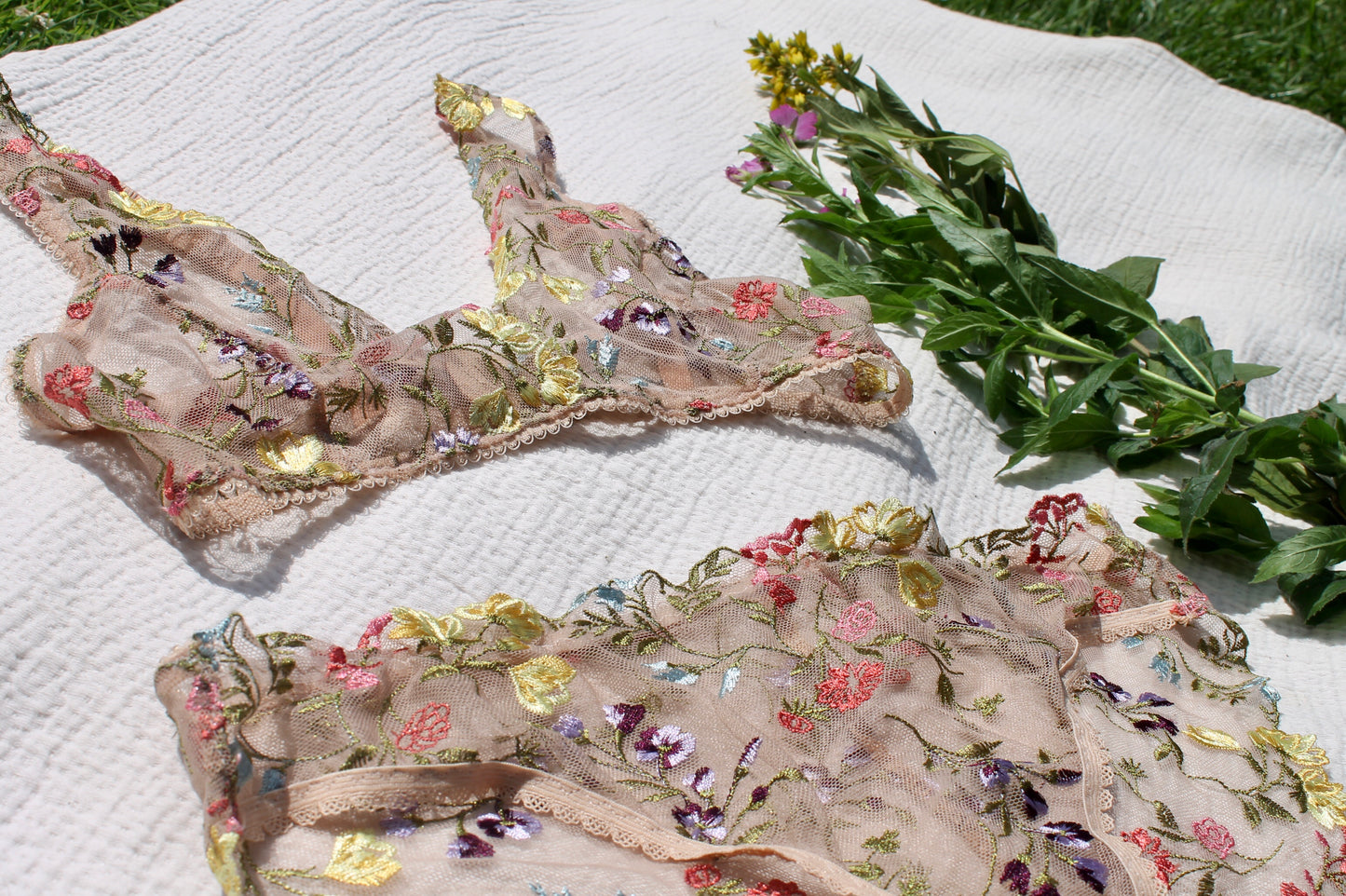 Close up of embroidered floral lace bralette and knickers