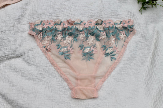 Blush lace underwear/knickers with embroidered flowers.