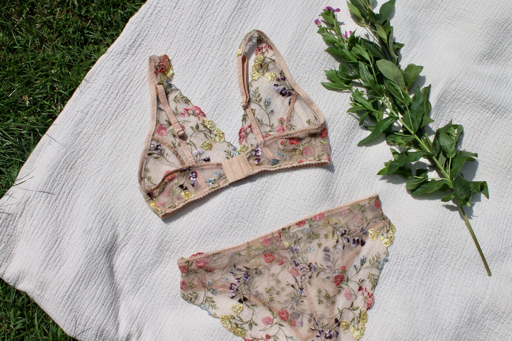 Back view of embroidered floral lace bralette and knicker set